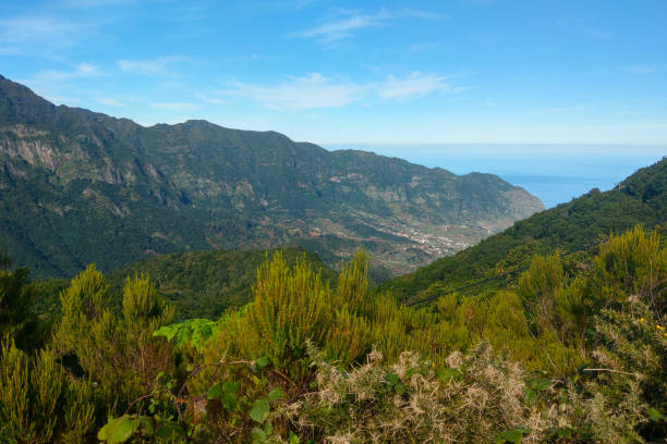 istock Beautiful mountain valley overlooking the ocean on a sunny day. 1734914284