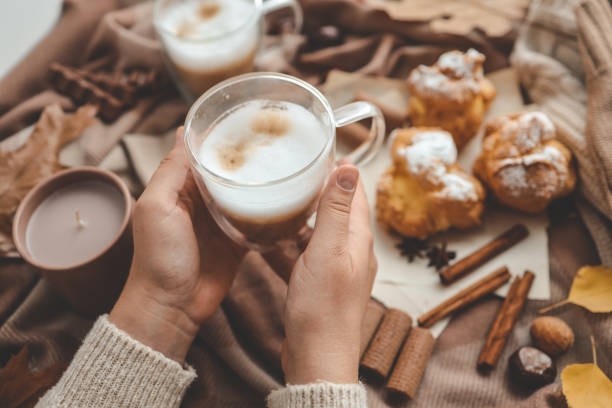 istock Cup of coffee in hands, cozy autumn 1734940405