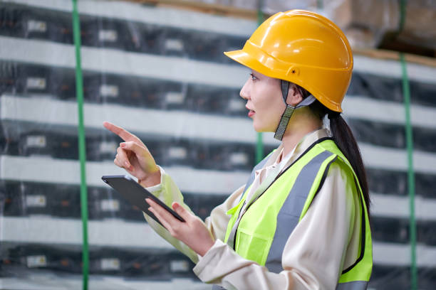 istock One Asian Females Worker Checklist Cargo at Warehouse 1734940929