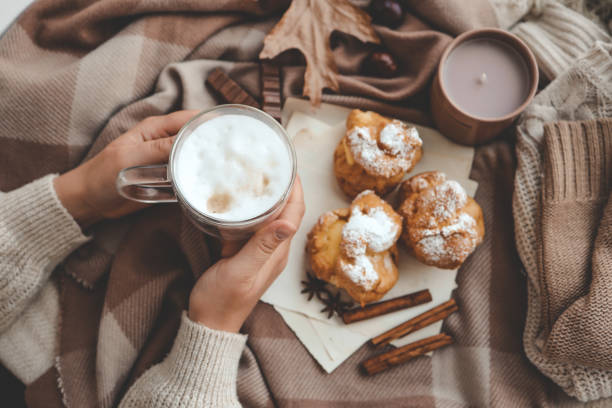istock Cup of coffee in hands, cozy autumn 1734949614