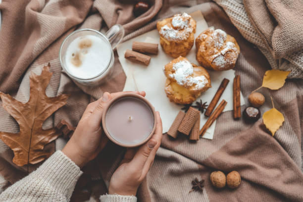 istock Cup of coffee in hands, cozy autumn 1734949620