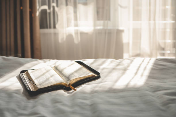 istock Open Bible on the bed, morning prayer 1734955064