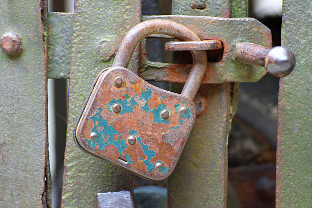 istock old rusty padlock that closes the scratch of an prison 173495922