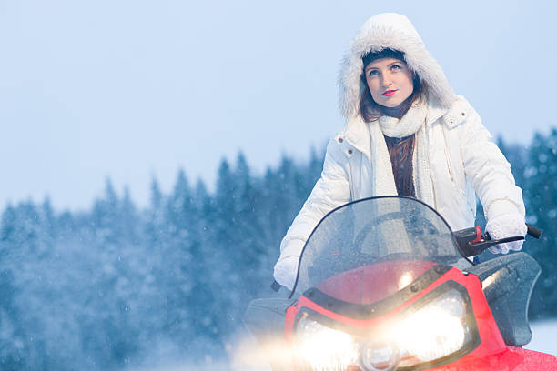 istock Woman and snowmobile 173496280