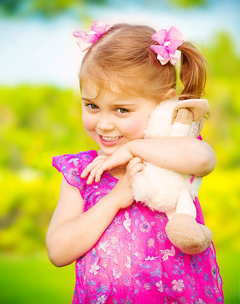istock Baby girl with soft toy 173496346