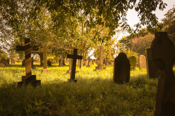 istock Autumnal view of an ancient English graveyard. 1734990043