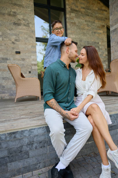 istock Smiling son hugs happy parents 1734997157