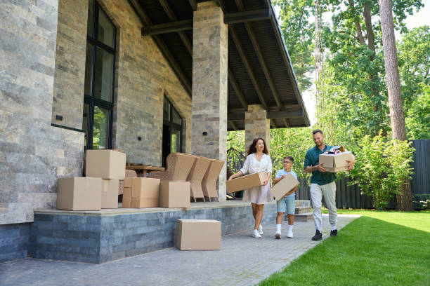 istock Parents and son move boxes with things to new house 1734997167