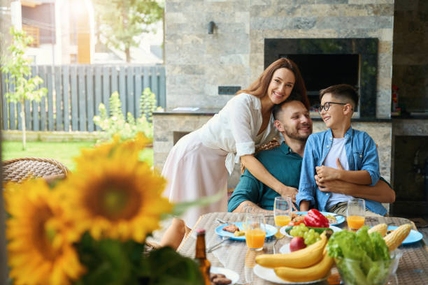 Friendly family has a nice conversation at the dinner table