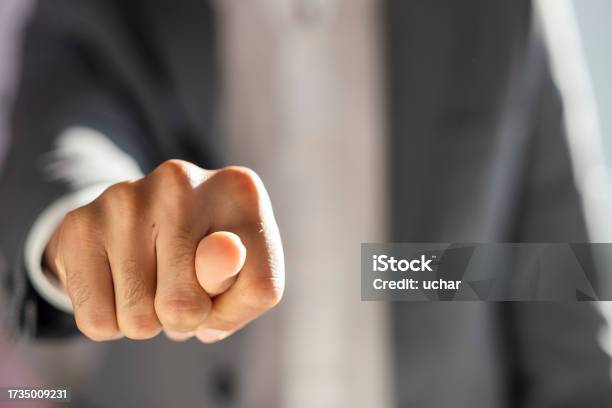 Businessman In A Suit Shows A Fig Sign Stock Photo - Download Image Now - Office, Active Lifestyle, Adult
