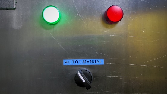 Control panel of the industrial machine in factory with switch and indicator lamp