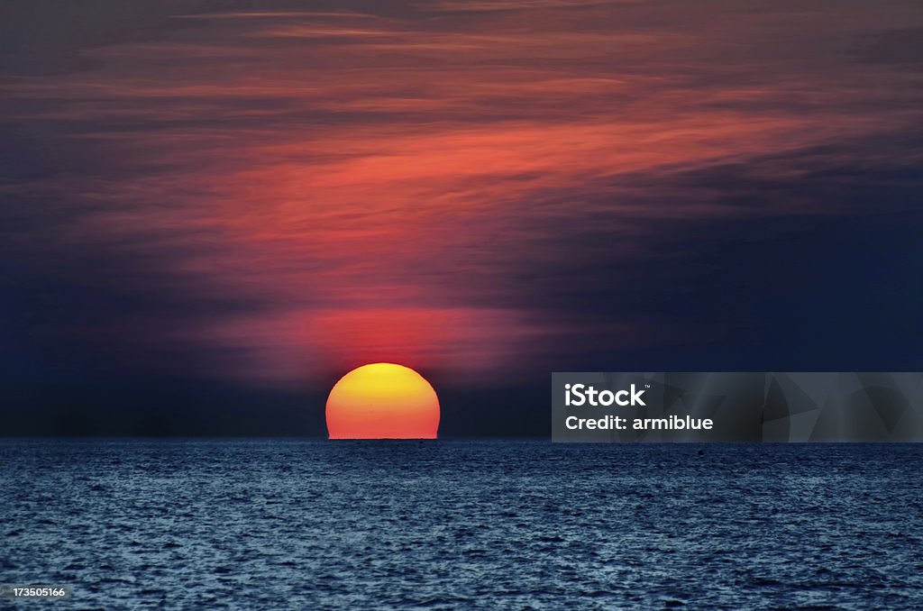 dramatic sunset on the sea sunset on the sea Sunset Stock Photo