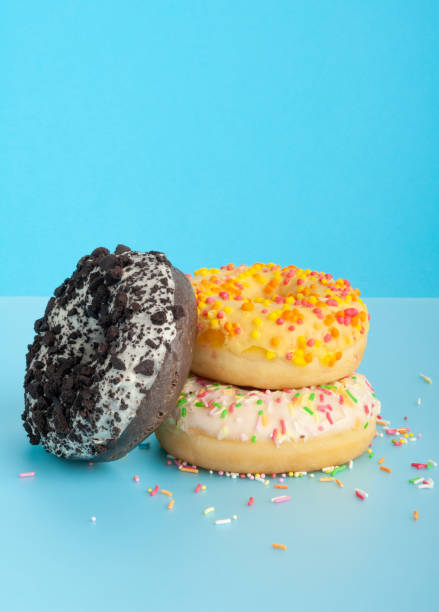 istock Doughnuts, Chocolate Brown and Pink Donut with Multicolored Sprinkles 1735075324