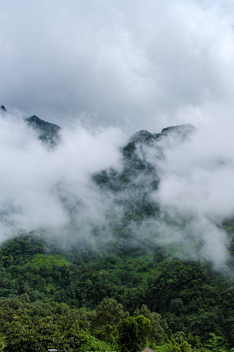 Mountain peak of Doi Luang Chiang Dao mountain hills in Chiang Mai, Thailand. Nature landscape in travel trips and vacations. Doi Lhung Chiang Dao Viewpoint with mist and fog during rain season