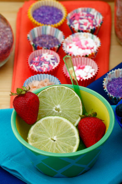 istock bowl of limes and strawberries 173507840