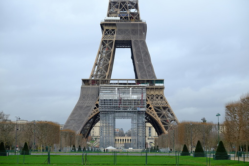 Paris, France - February 2nd, 2023: A close-up on the Eiffel Tower and its scaffolding.