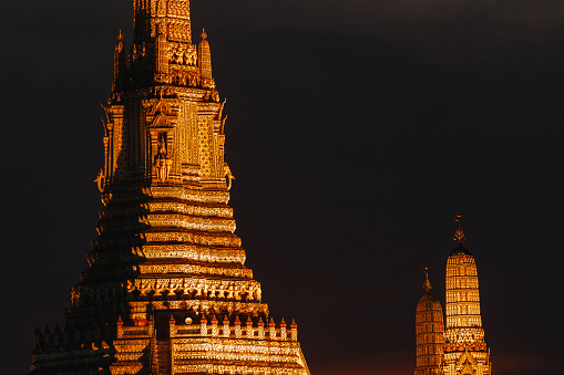 Wat Arun Temple during Sunset at Chao Praya River Bangkok, Thailand. High quality photo
