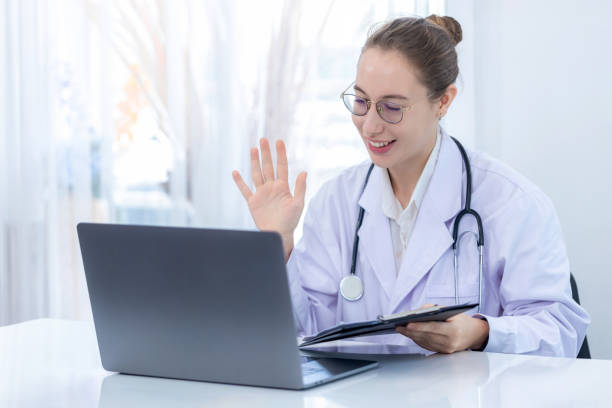 istock Scientist making online call using Laptop . Scientist or pharmacist work at modern Lab and virtual video conference meeting with colleagues family or friend 1735102408