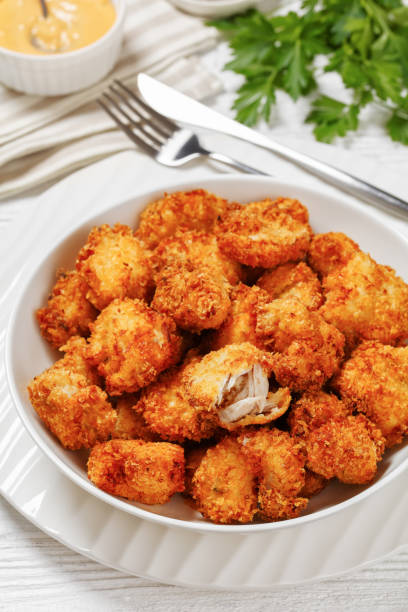 istock crispy fried panko breaded chicken bites in bowl 1735120807