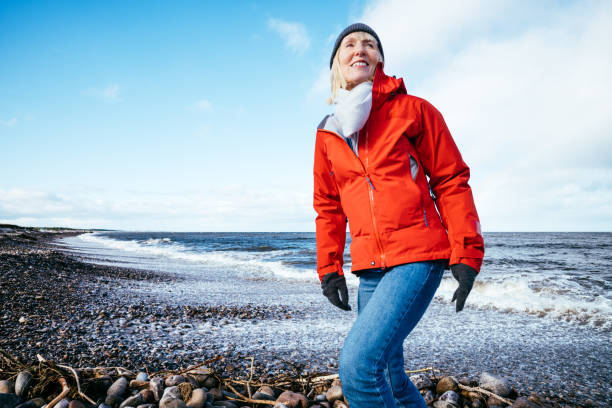 istock Autumn walk on pebble beach, Scotland 1735122946