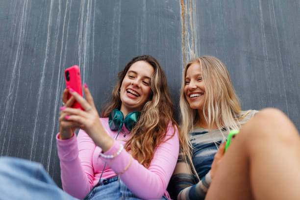 istock Young stylish generation Z girls spending time outdoors after school. 1735125094