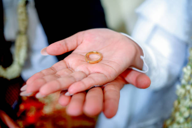 istock a ring on the hands of the bride and groom 1735129384