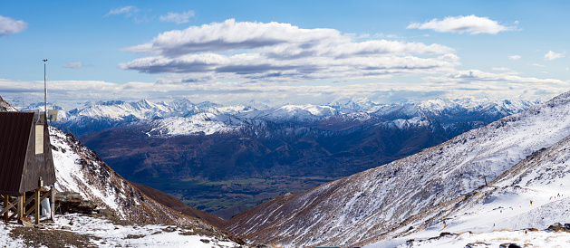 Panoramic view to the Coronet Peak over Speargrass flat from top of The Remarkables Ski Resort. Queenstown, New Zealand
