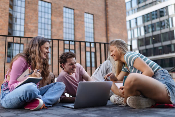 istock Group of generation Z students studying together after lecture on campus. Young stylish zoomers working together on school project, preparing a presentation. C 1735131489
