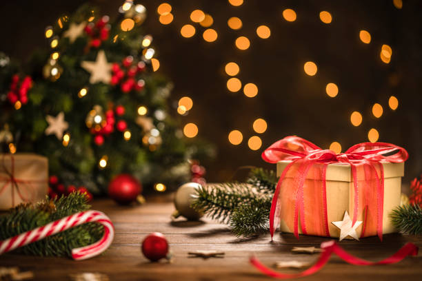 istock Christmas gift box on rustic wooden table 1735148666