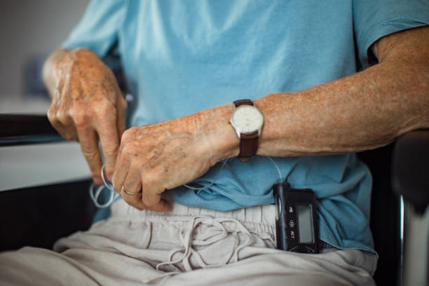 istock Senior man checking his blood sugar level on an insulin pump. 1735160185
