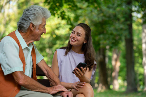 istock Caregiver helping senior diabetic man check his glucose data on smartphone outdoors, in park. 1735174074