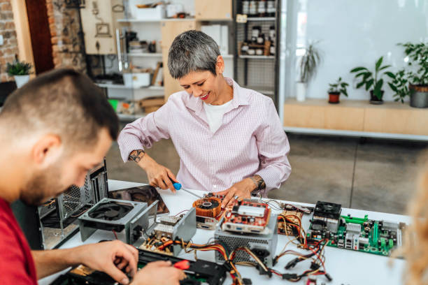 istock Woman is fixing the electrical components of a computer 1735197058
