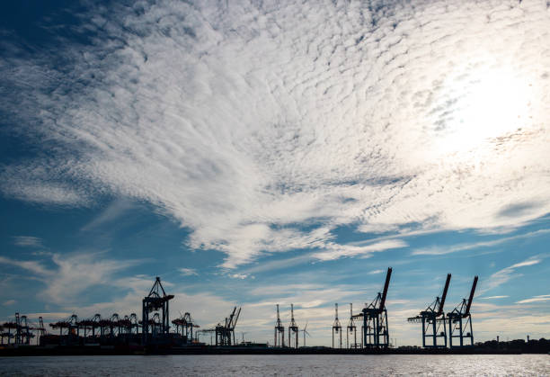 istock Dramatic sky over container seaport of Hamburg 1735199835