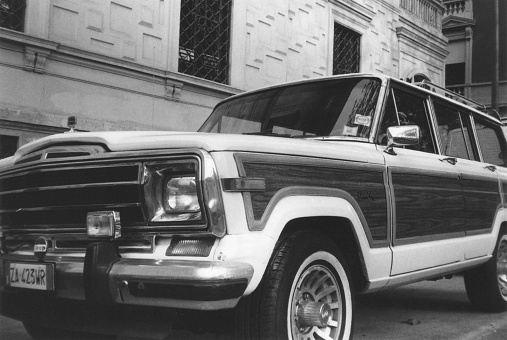Vintage American Car Detail Parked in a Street of Milano City Center, Italy. Black and White Film Photography