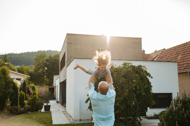 istock Father throwing little son up in the air. 1735217488