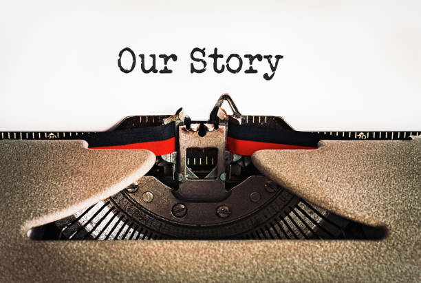 our story, says beginning of story on a page in an old-fashioned retro typewriter - writing typewriter 1950s style retro revival imagens e fotografias de stock