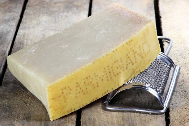 istock Italian hard cheese with grater 1735238335