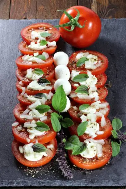 tomato-mozzarella on slate