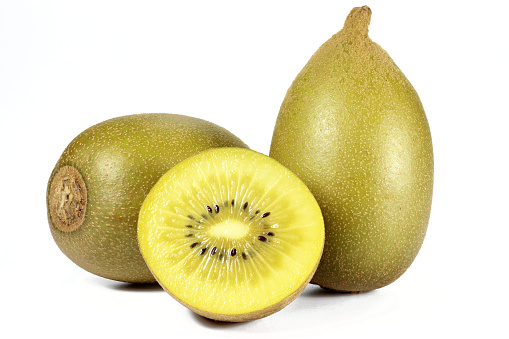 Stock photo showing a close-up view of healthy eating image of a group of two and a half Chinese gooseberry (kiwi).