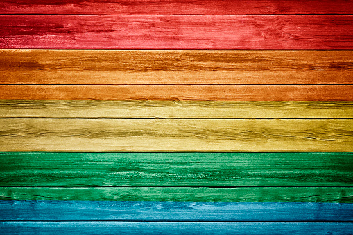 Pride flag with wooden background