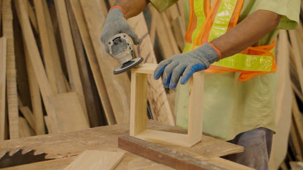 istock Close up hand asain senior carpenter using sander  box wood in home workshop. 1735300971
