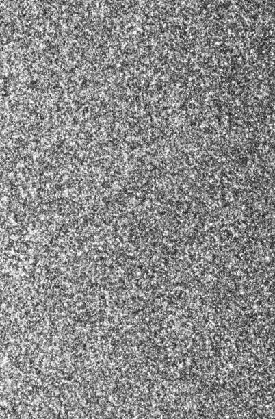 istock SILVERED GLITTER sparkling background with bright reflections and many small lights 1735325020