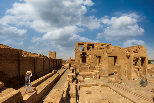 woman at the Karnak temple in Egypt in Cairo near the Nile River