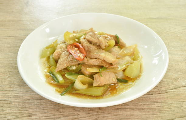 istock fried slice pork meat with onion and long chili 1735326844