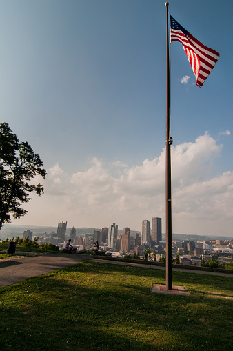 American Flag at Emeral View Park with Pittsburgh Skyline, USA. Summer, blue sky with few clouds