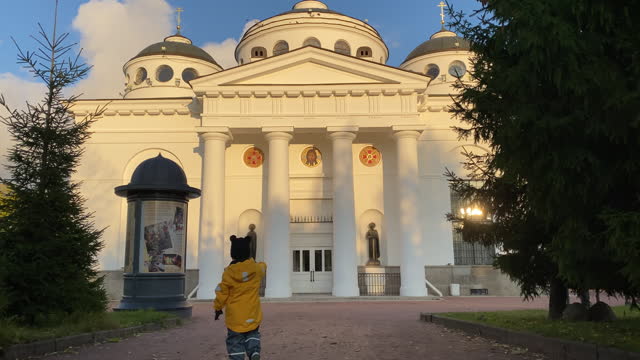 child walking along the footpath to the Orthodox Church, Ascension Cathedral