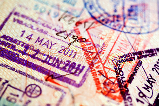 Various stamps inside passport stock photo