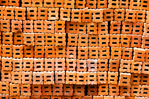 Stacked red stones at construction site in Bangkok