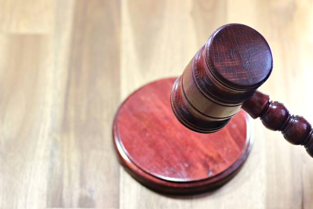 istock wooden gavel above sound block 1735352429