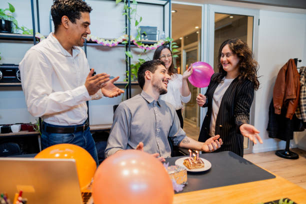 istock Team celebrating businessman birthday in the office 1735362080